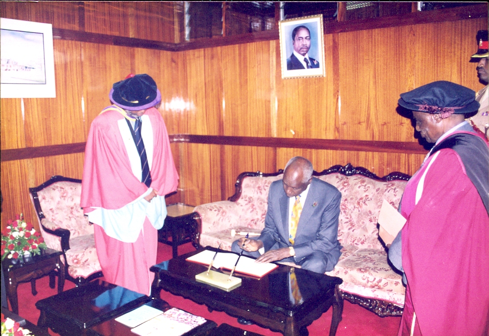 President Daniel Moi Signs Visitors Book After Presiding over UoN Graduation (Nov, 1998)