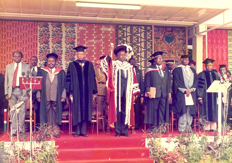 UoN Chancellor President Daniel Moi, VP Vice President Mwai Kibaki, Minister Oloo Aringo, Chairman Lawrence S. (Graduation, 1987)